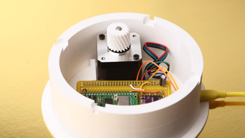 With the outer gear and bearing removed, you can see the stepper motor and Raspberry Pi Pico W