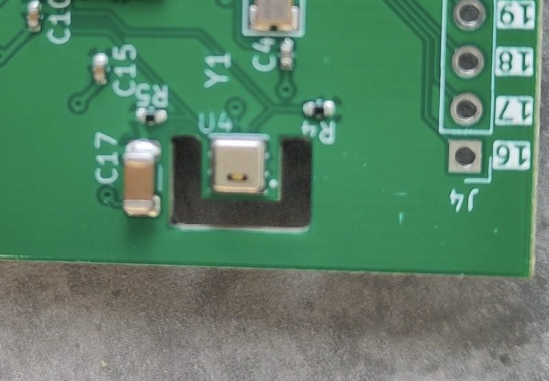 A break in the PCB thermally isolates the temperature sensor as much as possible