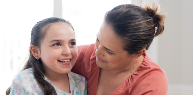 Clare,age 8, living with Rett syndrome, with her mom