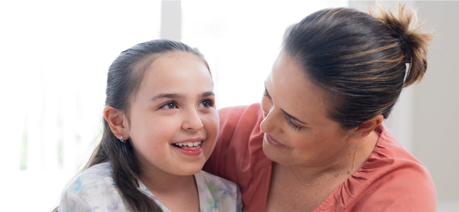 Clare,age 8, living with Rett syndrome, with her mom