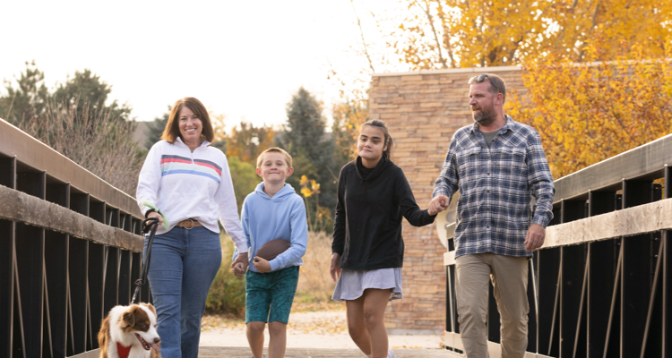 Ellie, age 15, living with Rett syndrome, with her family