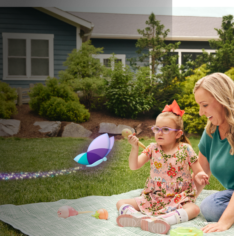 Clare, age 8, living with Rett syndrome, holding an ice cream cone. The light makes a circle around Clare.