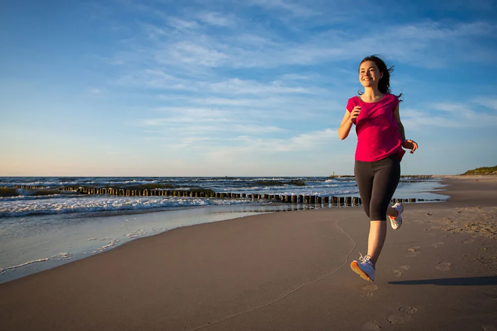 Girl running in beach - mask group