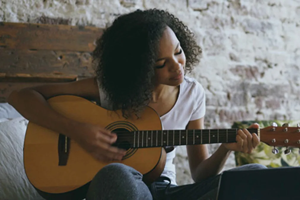 Girl playing guitar