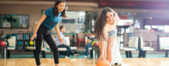 Girls playing bowling