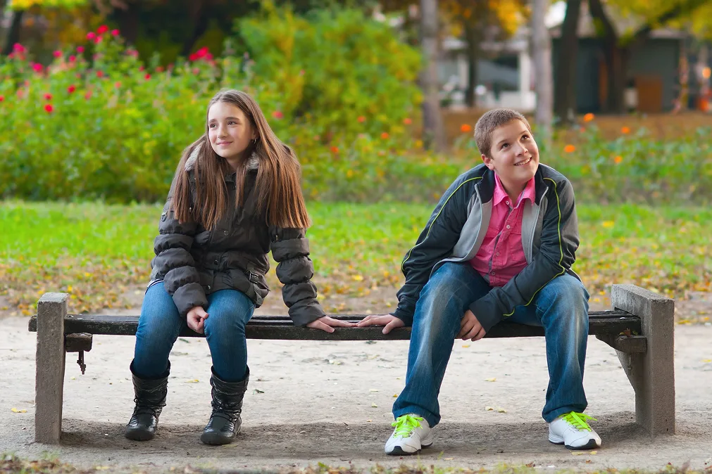 boy and girl sitting together