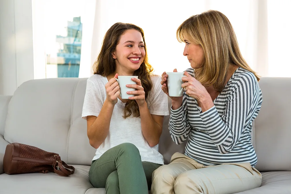 daughter with mother drinking coffee