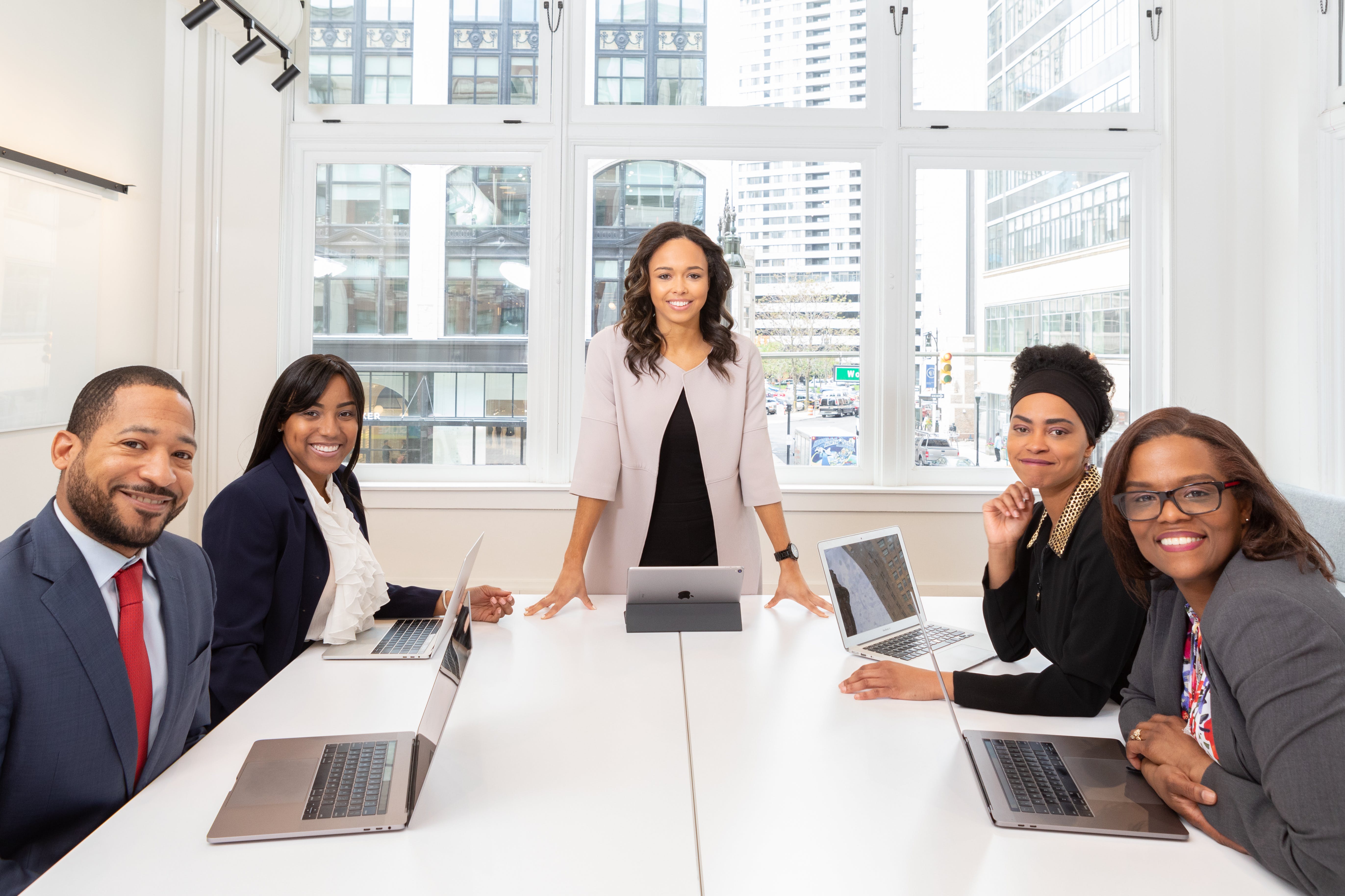 Five people in a meeting room