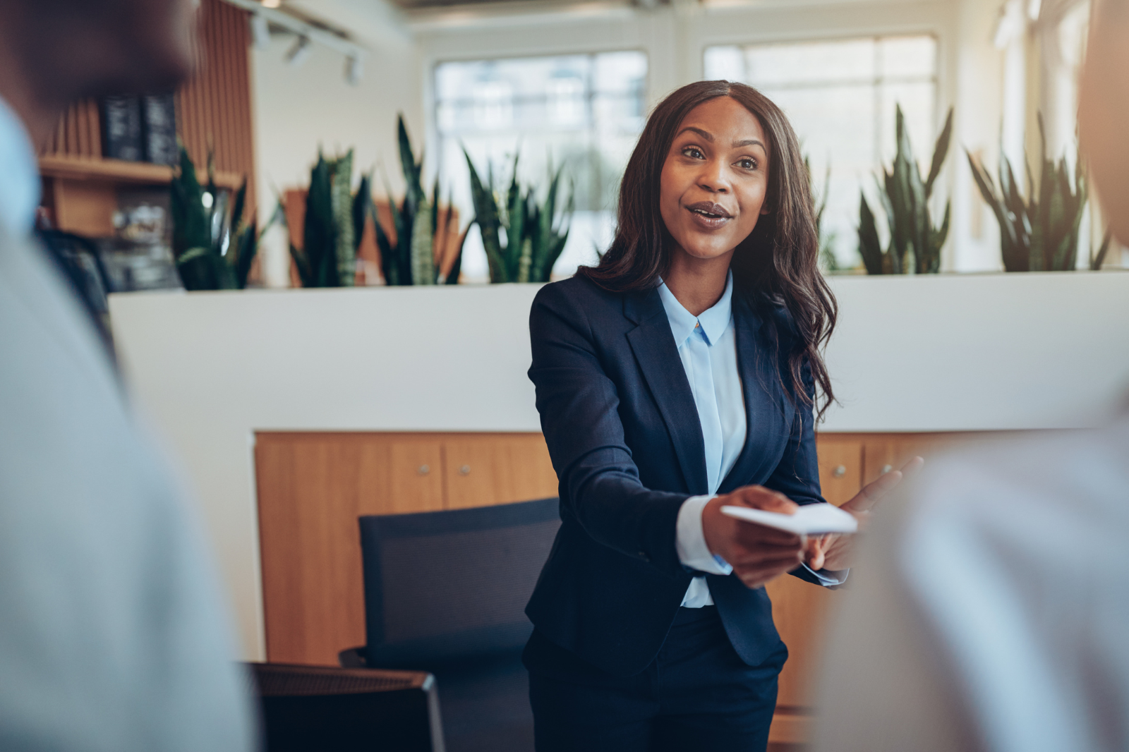 Professional woman sitting down in a meeting