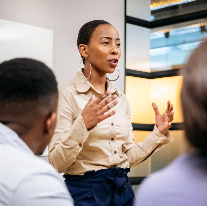 Team leader speaking to a group of people