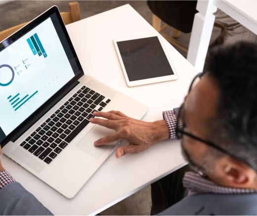 Person reviewing data on a laptop