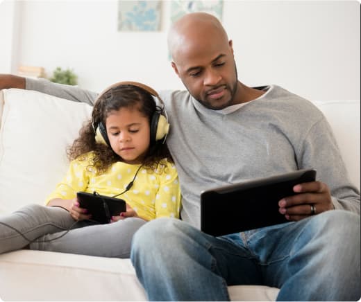 Man with daughter studying