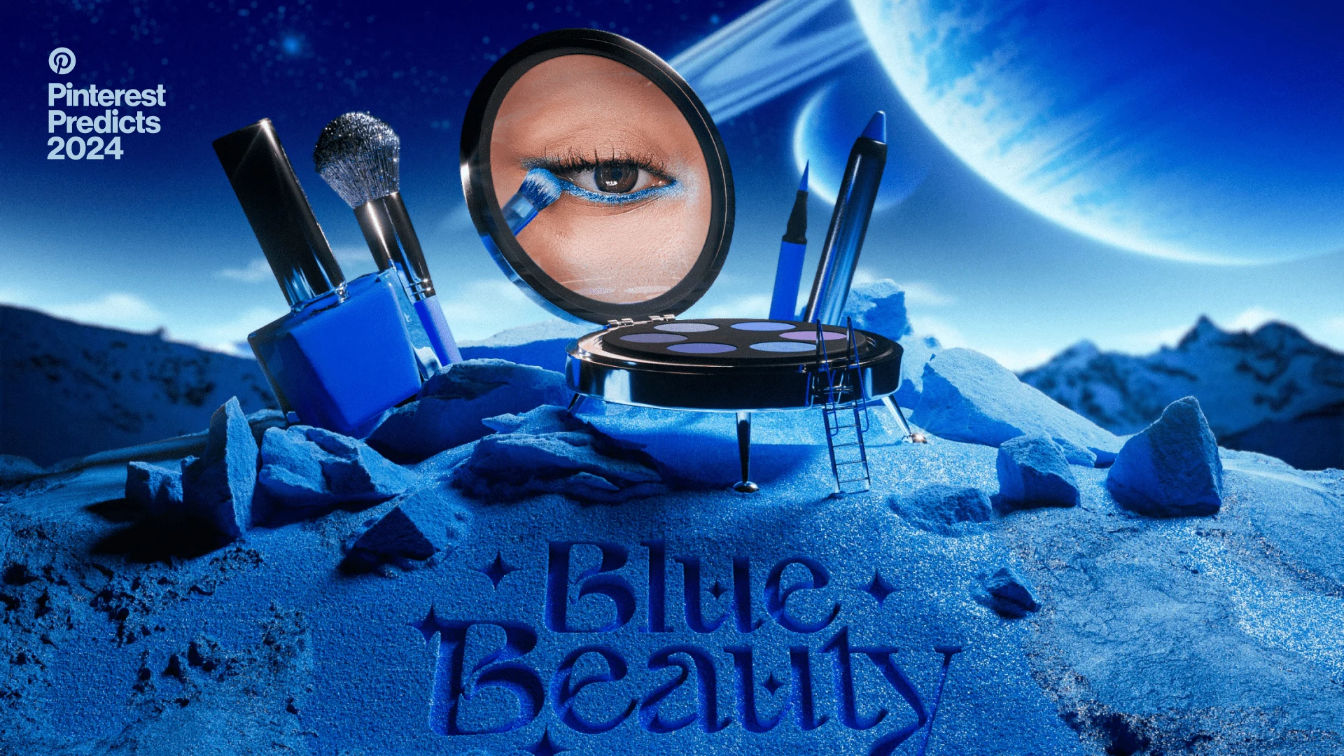 on a miniature moon landing, an eye palette is the spaceship and reveals a blue eye makeup, side by side with blue liners, brush and nail polish