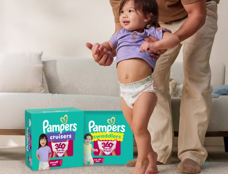 Toddler walking with parent's help, wearing Pampers 360 diapers