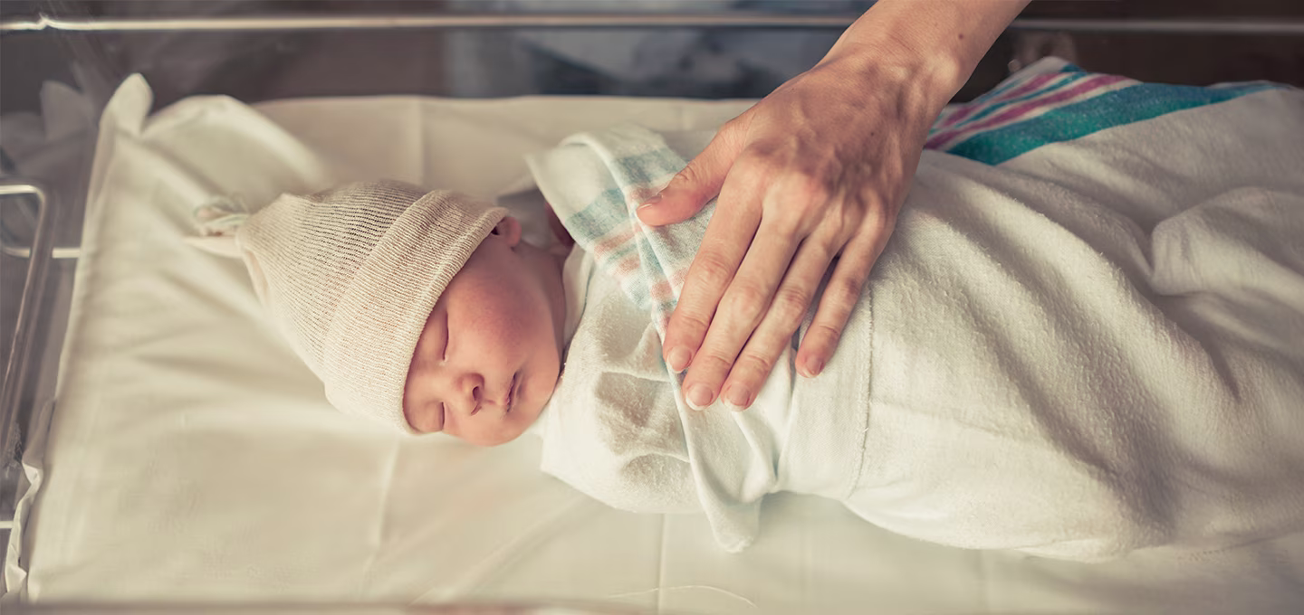 How do you swaddle a baby step by step