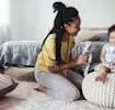 A mother and toddler sharing a joyful moment together