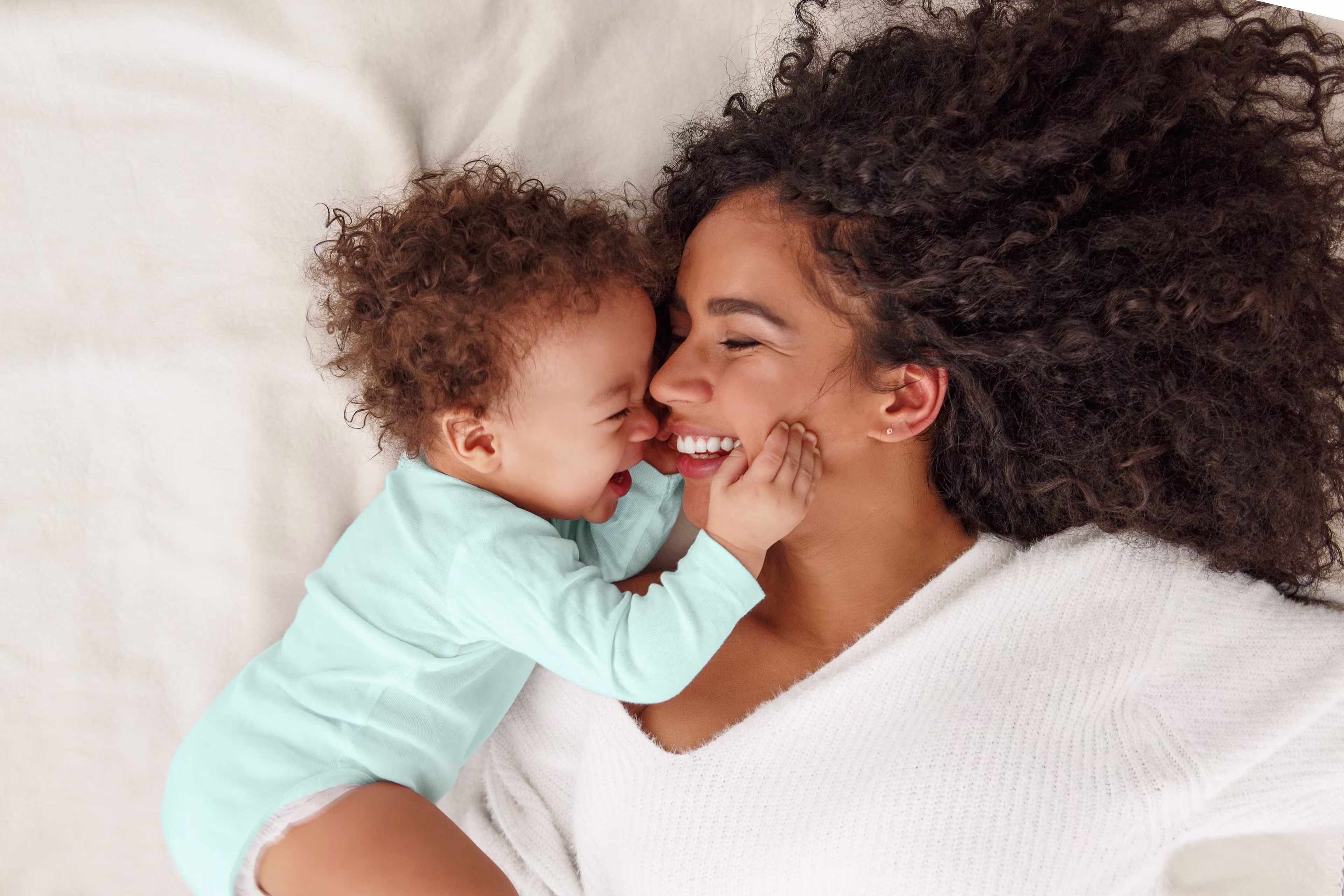 Woman holding awake baby