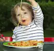 Toddler-eating-with-parent