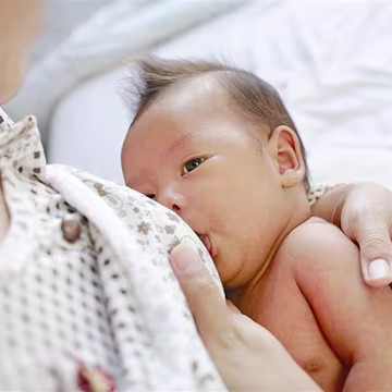 Woman breastfeeding baby
