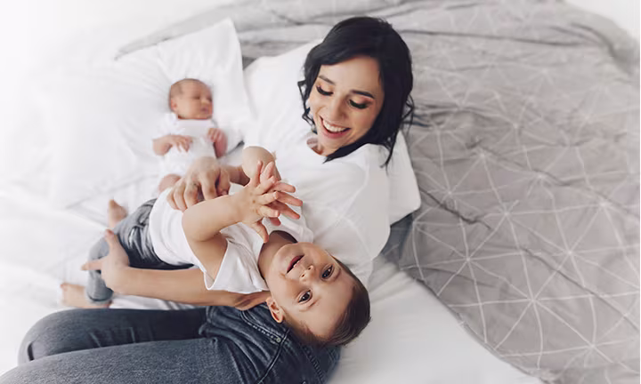 Siblings playing in kids room