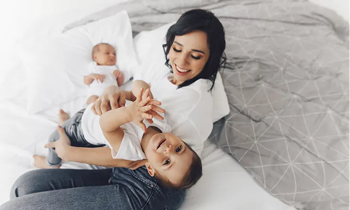 Siblings playing in kids room