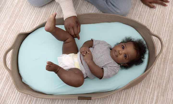 Baby lying in bassinate