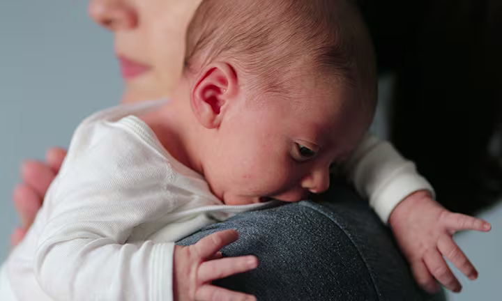 Baby Crying on Mother’s Shoulder