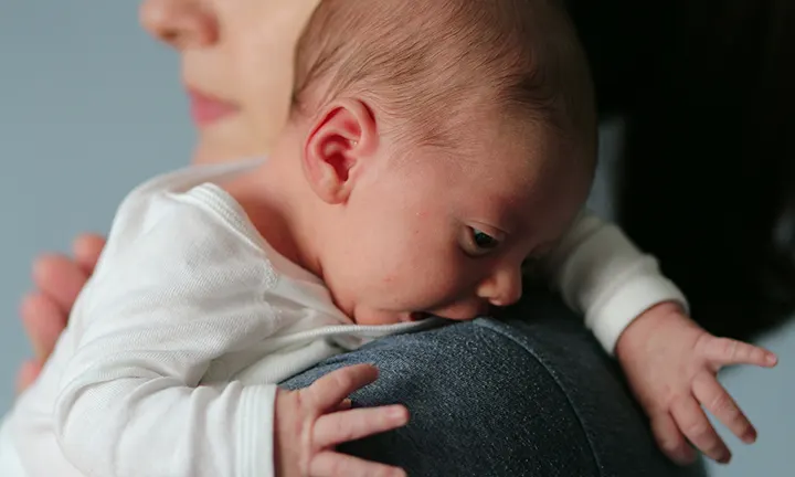 Baby Crying on Mother’s Shoulder