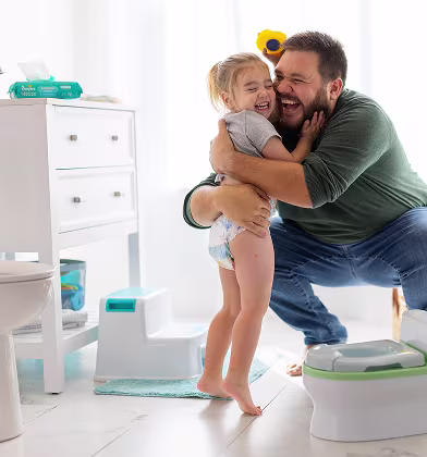 A loving father joyfully interacts with his two toddlers, showcasing their playful bond. The bright, colorful setting highlights the warmth and happiness of family moments, making it a perfect representation of parenting joy.