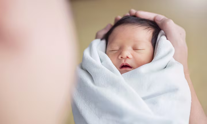 When to stop swaddling baby