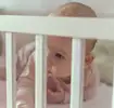 Baby in crib during Ferber Method sleep training