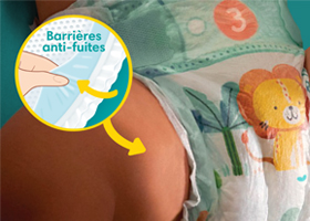Flèche pointant la double barrière anti-fuite du lange portée par bébé