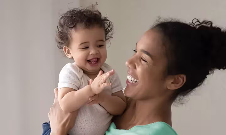 Banner image of a baby and mom laughing