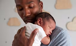Dad nursing baby to sleep