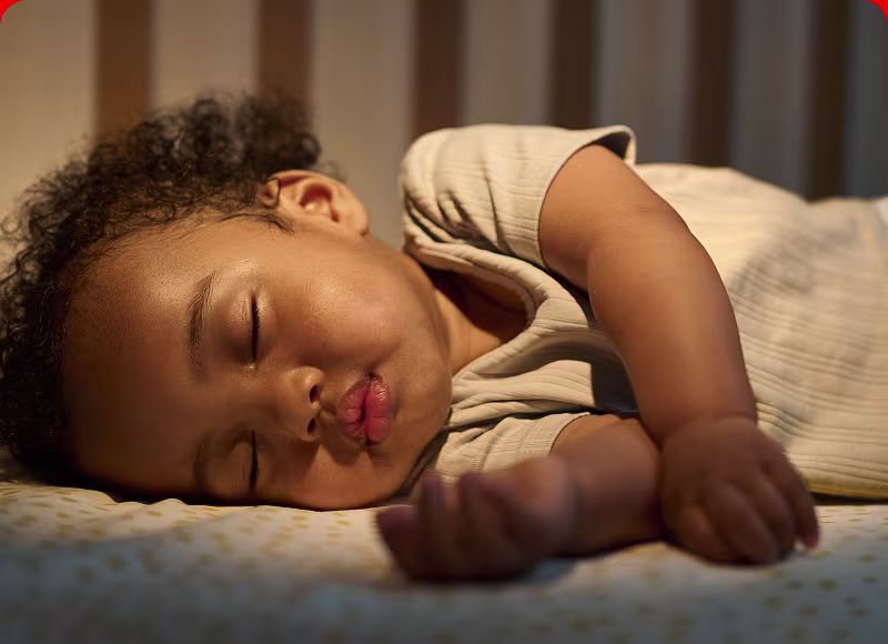 Baby sleeping peacefully in their crib