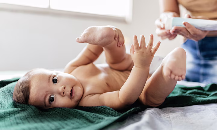  Baby lying on back during diapering