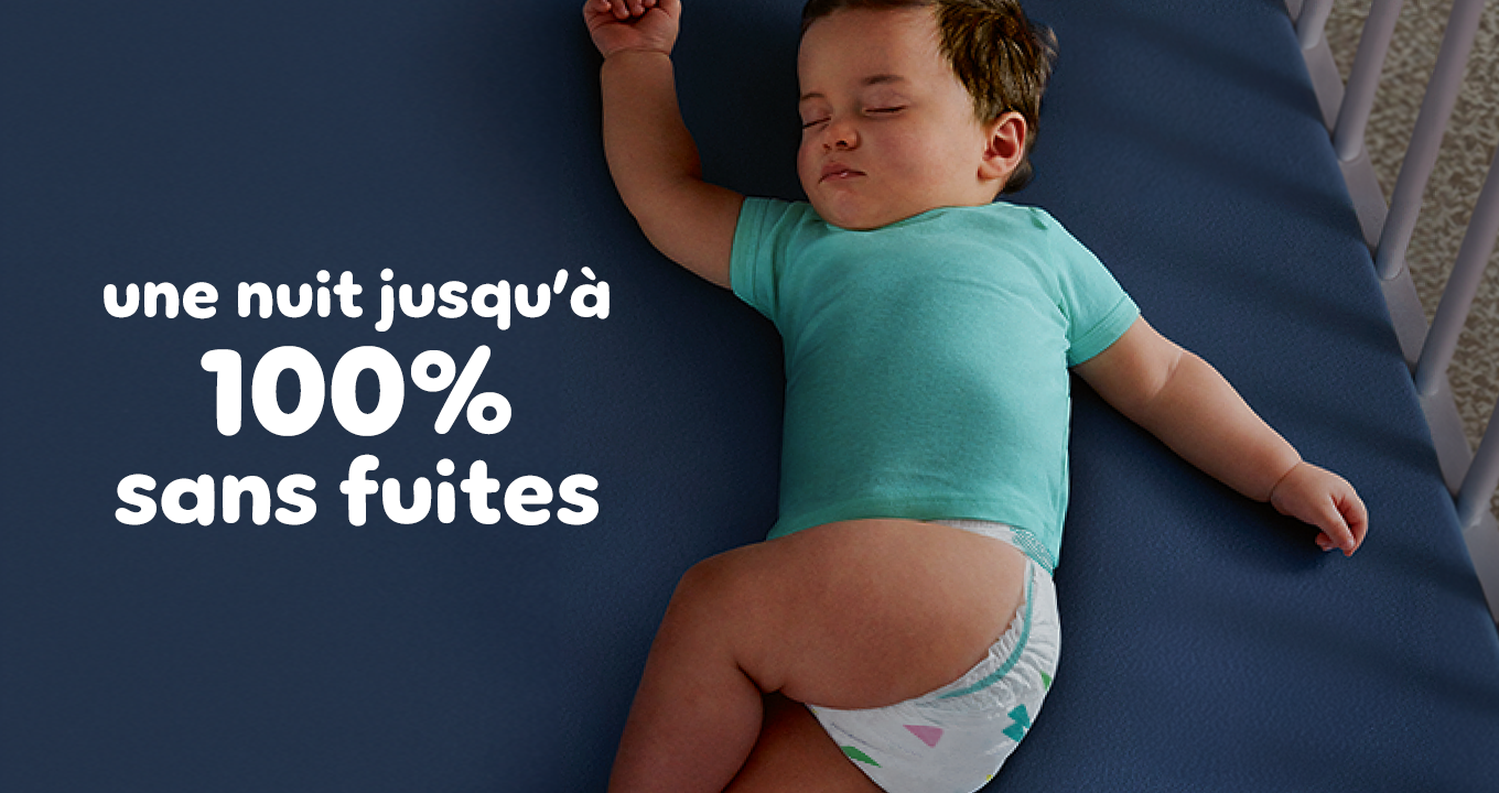Bébé qui dort avec un lange Pampers Baby-Dry