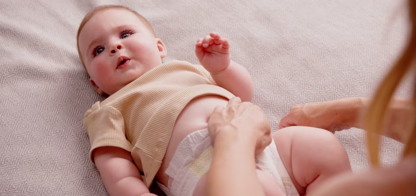 baby lying on a firm surface