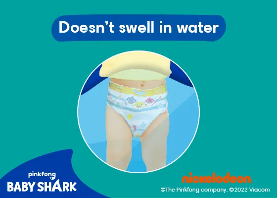 Baby in swimming pool with Pampers Splashers on.