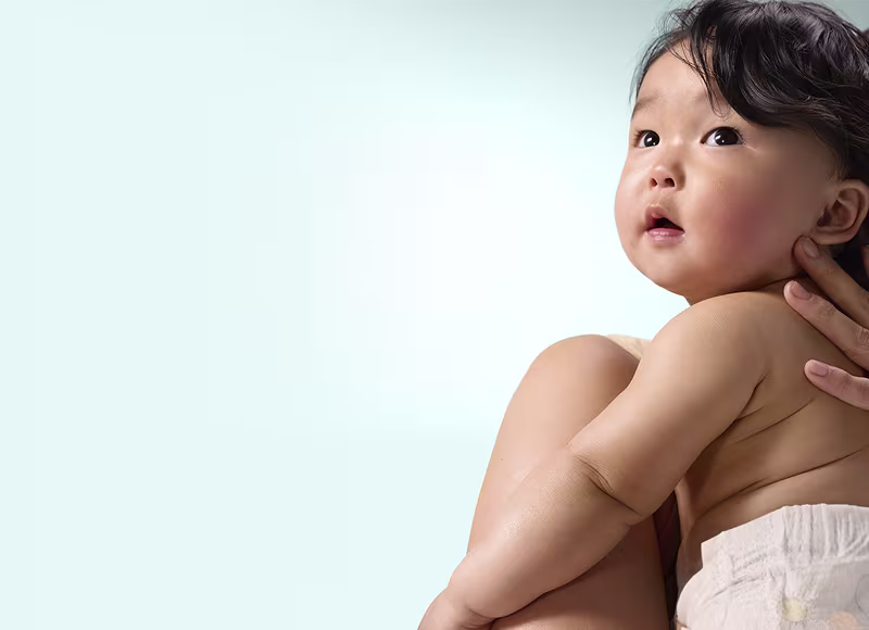 Pack of Pampers Premium Protection New Baby in a baby room