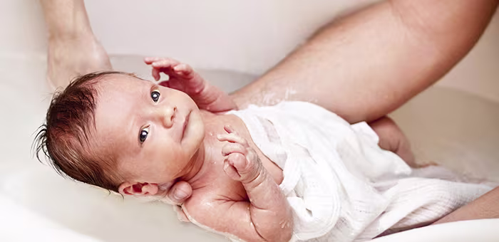 El primer baño de la guagua