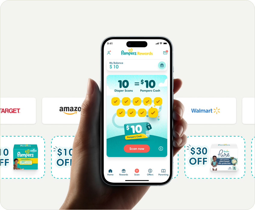 Hand holding a phone showing the Pampers rewards app homescreen