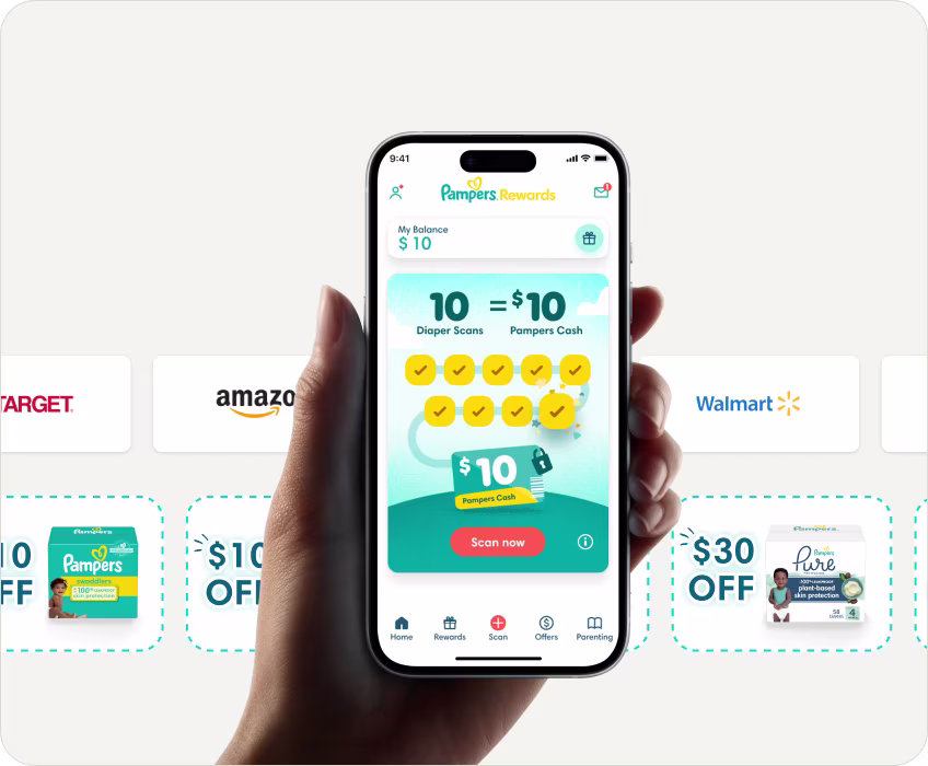 Hand holding a phone showing the Pampers rewards app homescreen
