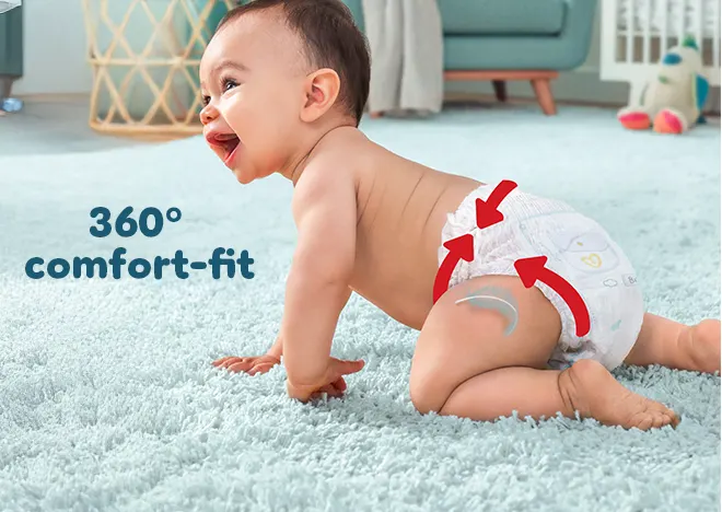 Baby crawling with nappy pant on, showing 360 comfort fit.