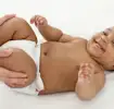 Baby lying on their back getting a massage