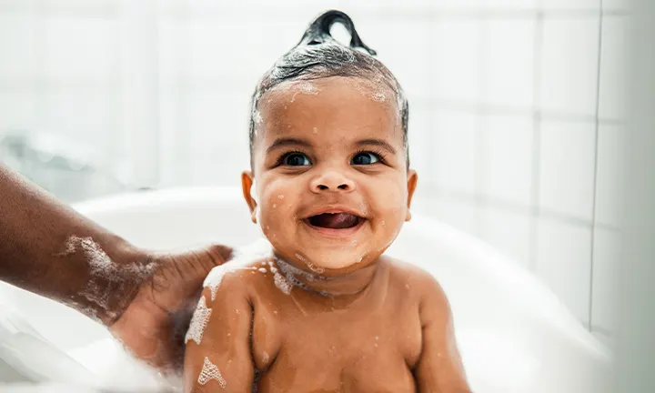 Banner Image of Toddler Bathing for Article on Toddler Bath Time