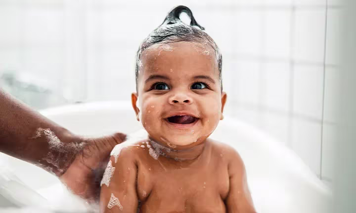 Banner Image of Toddler Bathing for Article on Toddler Bath Time