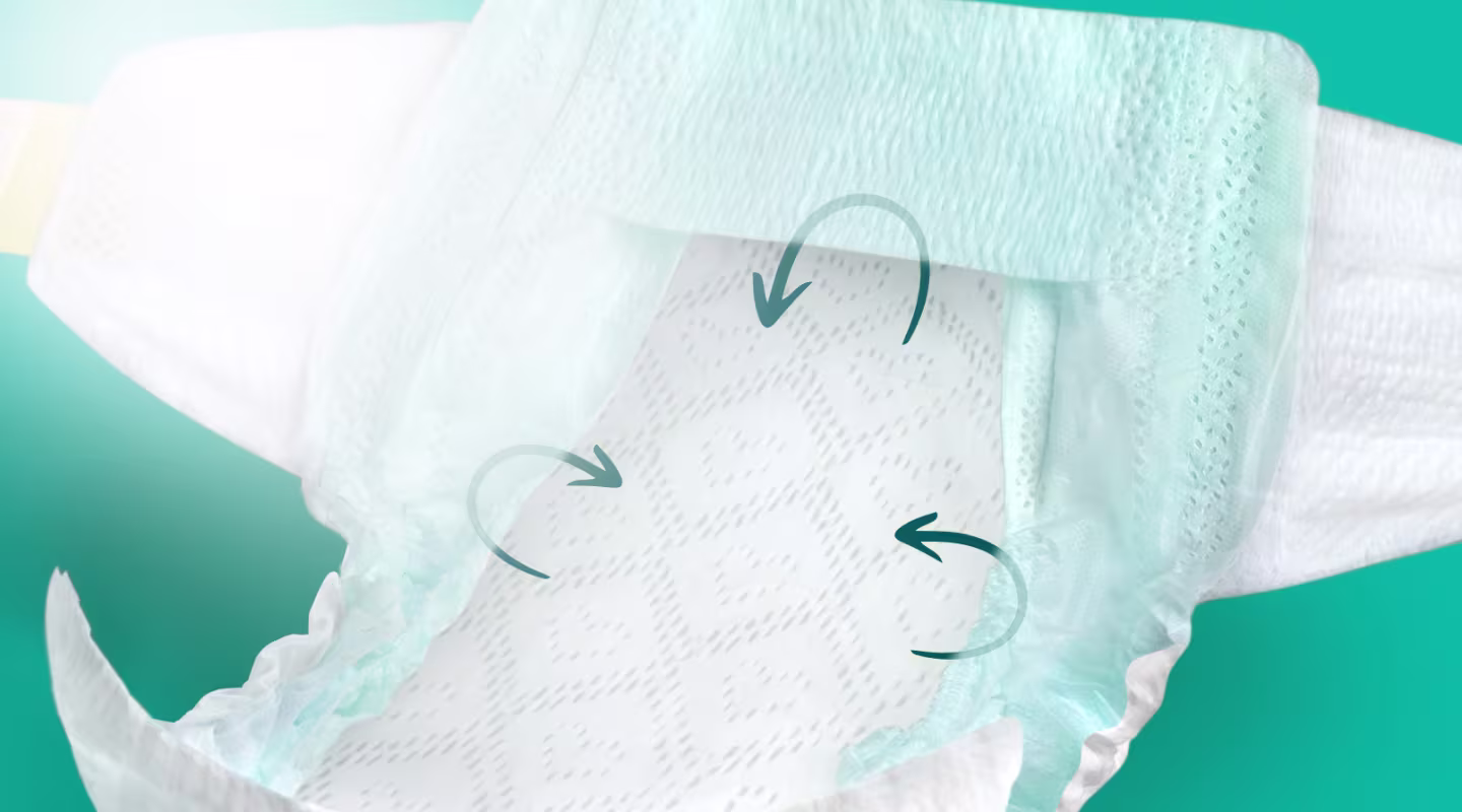 Image showing the inside of a Pampers Swaddlers diaper with arrows showing the all around leakguard