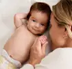 Woman holding baby’s hand