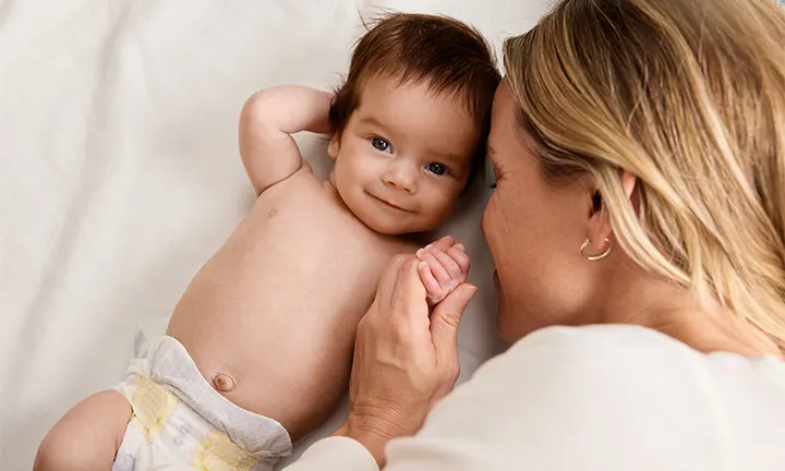 Woman holding baby’s hand